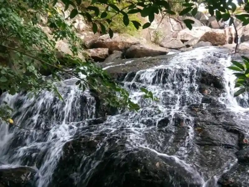 Lower Ghaghri Falls in Netarhat surrounded by rocks and lush green forest